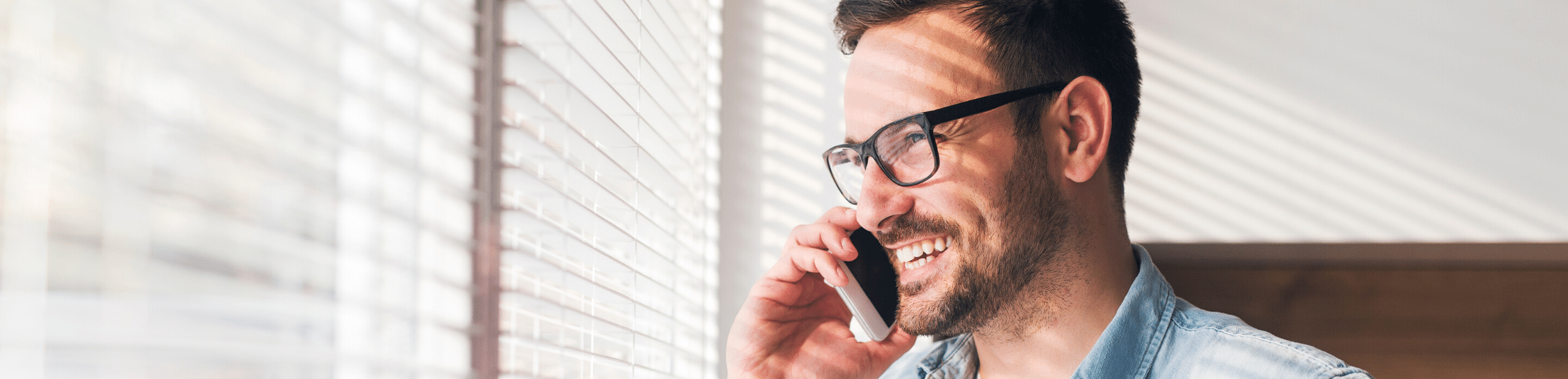 man on phone smiling